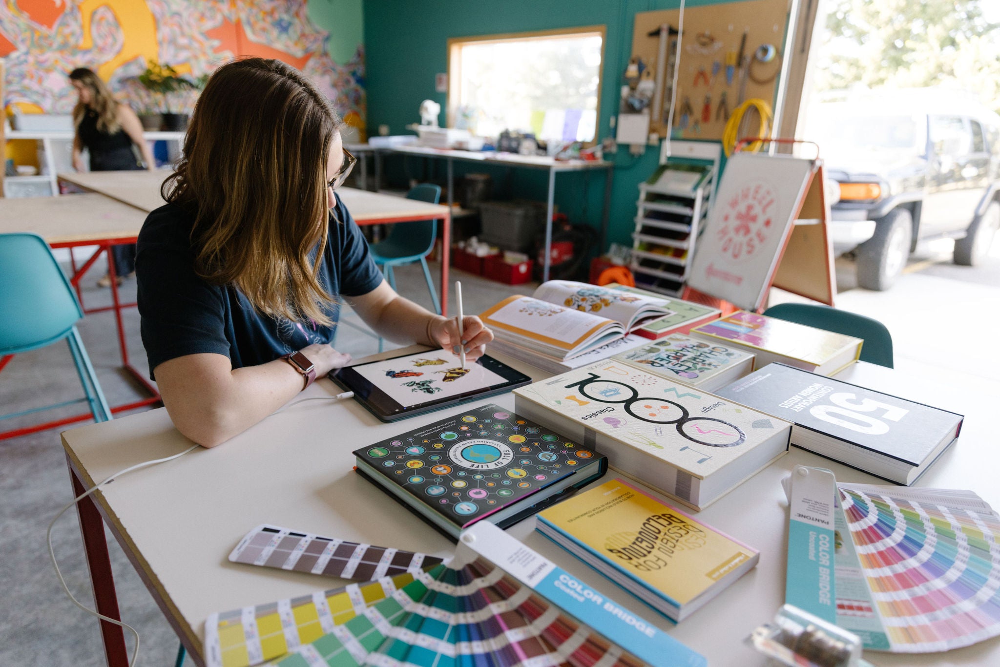 Artist working during Wheelhouse open studio hours